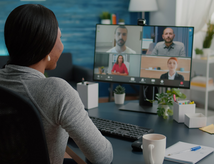 a woman attending a video conference meeting